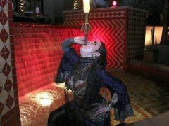 Sword swallowing, belly dancer & fire!